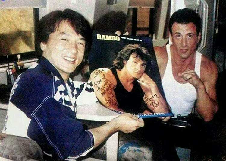 Jackie Chan getting Sylvester Stallones autograph on the set of Demolition Man