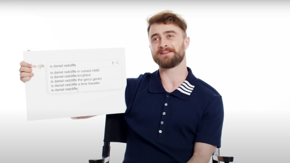 Daniel Radcliffe answers the internets most burning questions he holds up a sign with the questions